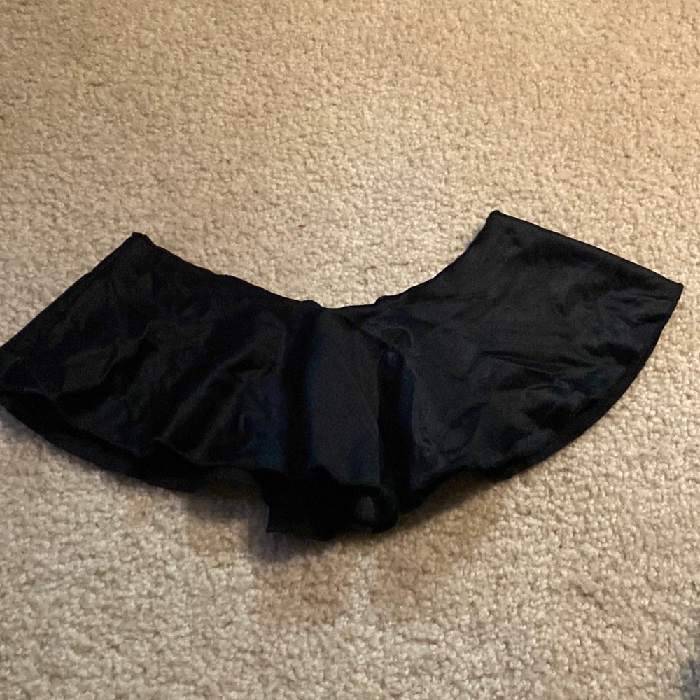 Black frilly skirt.